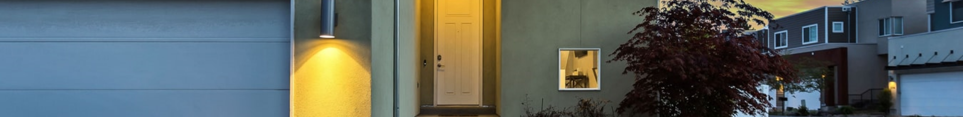 exterior of white home at dusk